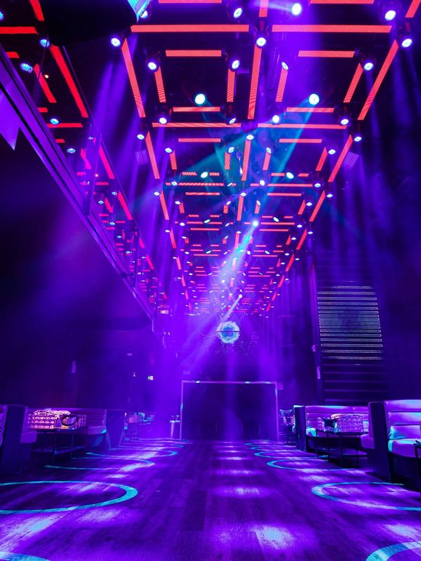 Packed dance floor with hands raised at 44 Toronto nightclub