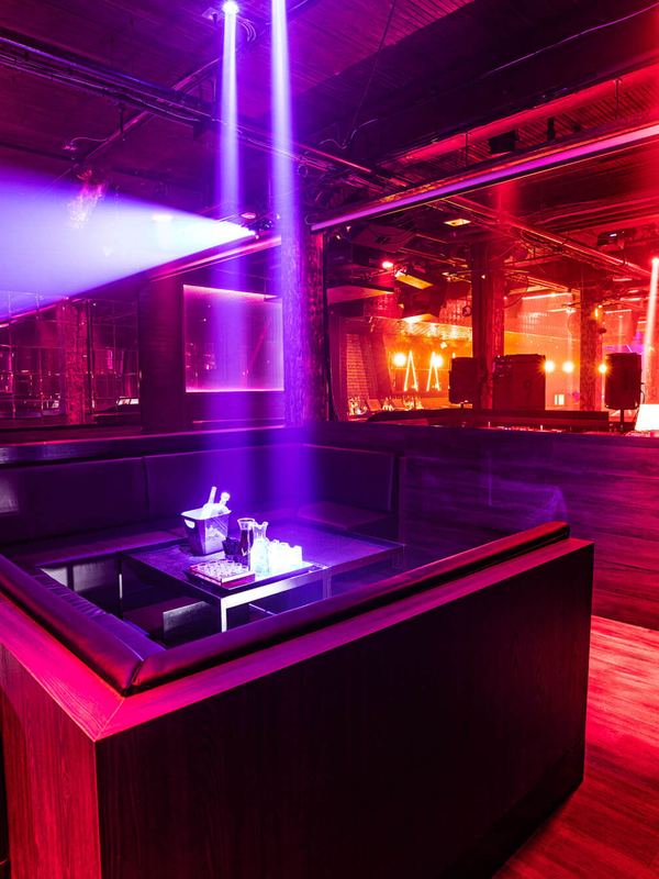 Dancers under green lasers at Century nightclub in Toronto