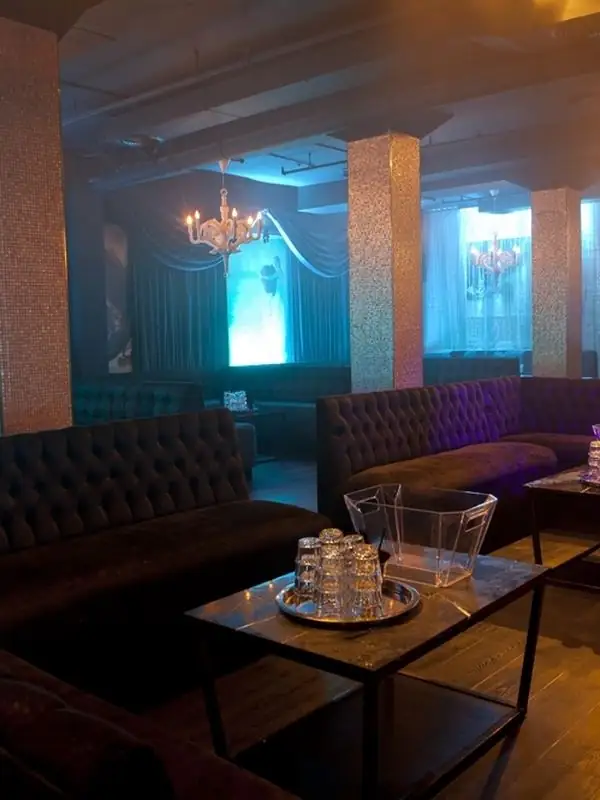 Blue-lit lounge seating at Fiction Toronto